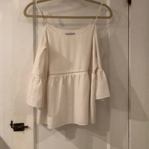 Cold shoulder white silk peplum top